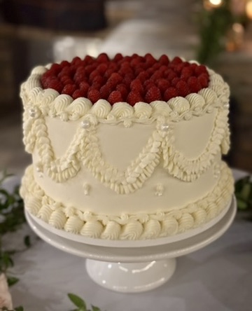 White cake with raspberries